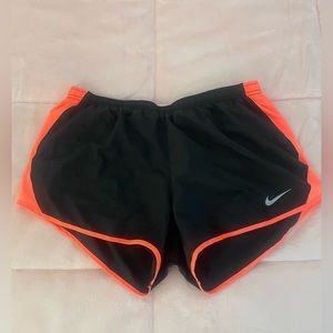Black and Neon Orange Nike shorts